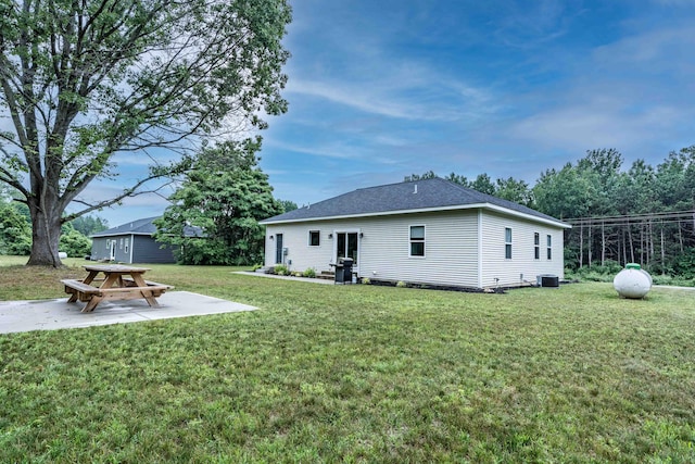 7920 W Juniper Beach Rd, Mears, MI 49436 - rear view of house featuring a yard and a patio