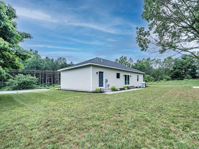 7920 W Juniper Beach Rd, Mears, MI 49436 - view of side of property with a yard