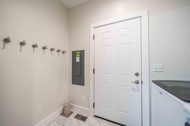 7920 W Juniper Beach Rd, Mears, MI 49436 - doorway to outside featuring electric panel and washing machine and clothes dryer