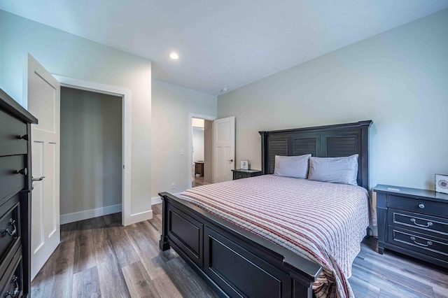 7920 W Juniper Beach Rd, Mears, MI 49436 - bedroom featuring dark wood-style floors and recessed lighting