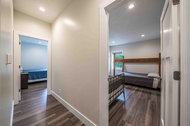 7920 W Juniper Beach Rd, Mears, MI 49436 - corridor featuring dark wood-type flooring and recessed lighting