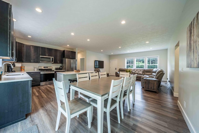 7920 W Juniper Beach Rd, Mears, MI 49436 - dining space featuring recessed lighting and dark wood finished floors