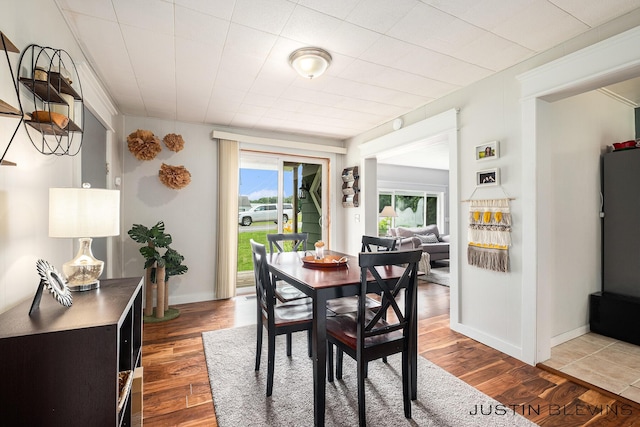 8277 Alpine Ave NW, Sparta, MI 49345 - dining space featuring wood finished floors