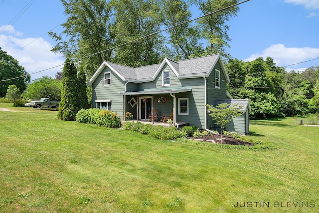 8277 Alpine Ave NW, Sparta, MI 49345 - view of front of house featuring a porch and a front lawn