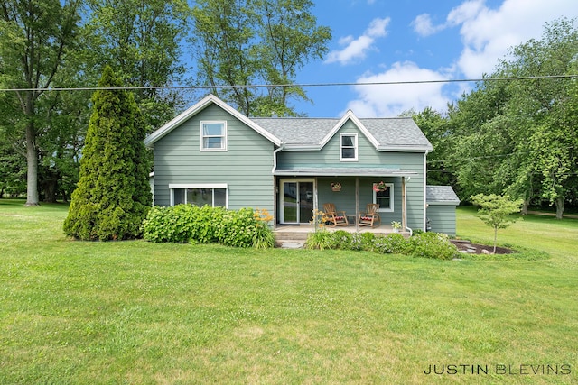 8277 Alpine Ave NW, Sparta, MI 49345 - view of front of home with a porch, a front yard, and a shingled roof