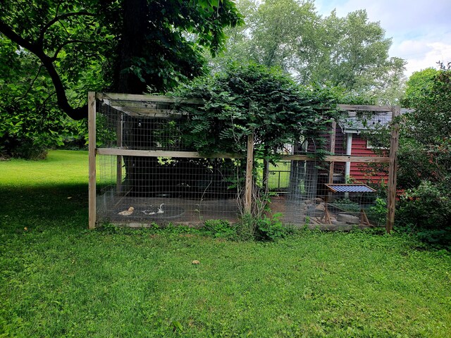 8277 Alpine Ave NW, Sparta, MI 49345 - view of poultry coop with a yard