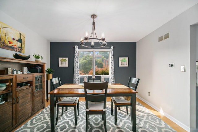 1101 Heritage Dr, Saline, MI 48176 - dining space with a chandelier and light wood finished floors
