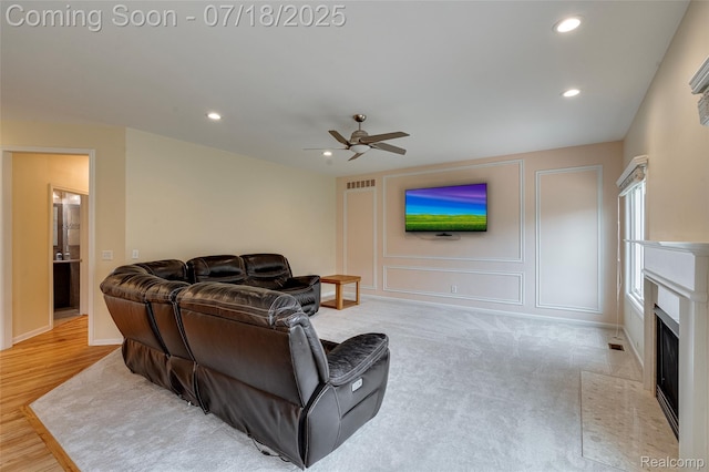 24352 Cavendish Ave W, Novi, MI 48375 - living area with ceiling fan, recessed lighting, and a fireplace with flush hearth