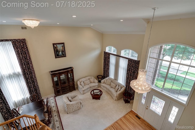 24352 Cavendish Ave W, Novi, MI 48375 - living area featuring crown molding, wood finished floors, and lofted ceiling