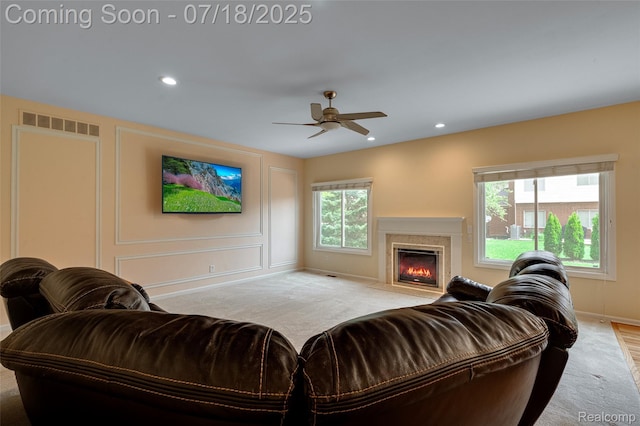 24352 Cavendish Ave W, Novi, MI 48375 - living room featuring a ceiling fan, a fireplace, light colored carpet, and recessed lighting