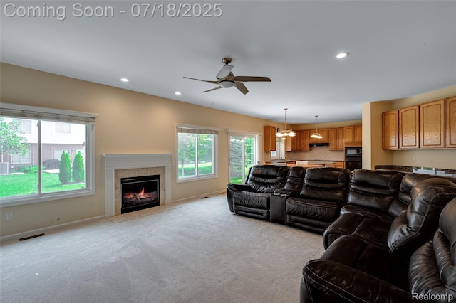 24352 Cavendish Ave W, Novi, MI 48375 - living area with ceiling fan, light colored carpet, a premium fireplace, and recessed lighting