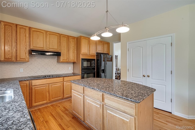 24352 Cavendish Ave W, Novi, MI 48375 - kitchen featuring light wood-type flooring, black appliances, backsplash, and dark stone countertops