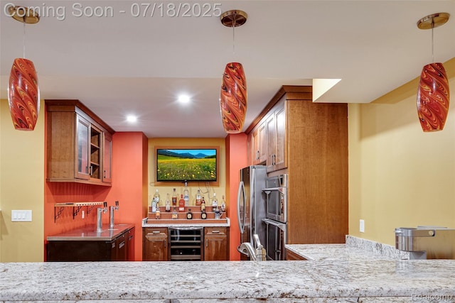 24352 Cavendish Ave W, Novi, MI 48375 - indoor wet bar with beverage cooler, decorative light fixtures, recessed lighting, and appliances with stainless steel finishes