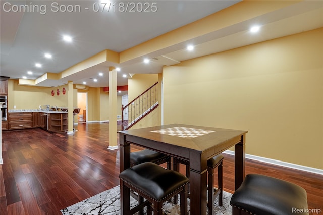 24352 Cavendish Ave W, Novi, MI 48375 - dining space featuring dark wood-style flooring, stairs, and recessed lighting