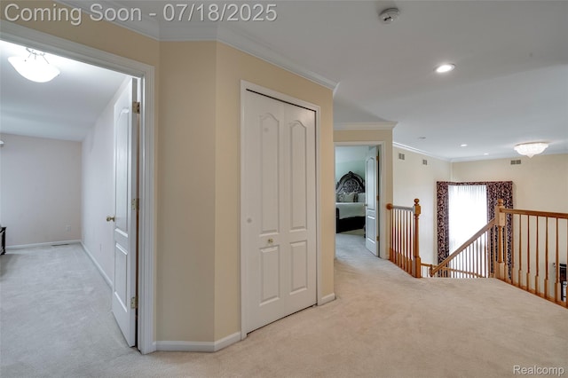 24352 Cavendish Ave W, Novi, MI 48375 - hallway with light carpet, ornamental molding, an upstairs landing, and recessed lighting
