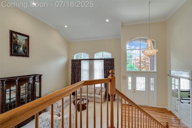 24352 Cavendish Ave W, Novi, MI 48375 - stairway with ornamental molding, recessed lighting, wood finished floors, and a chandelier