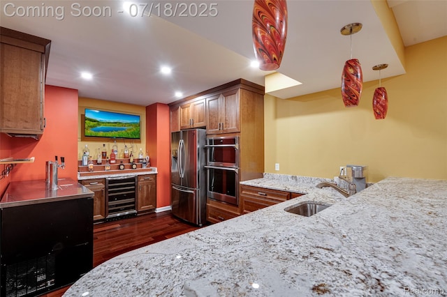 24352 Cavendish Ave W, Novi, MI 48375 - kitchen with wine cooler, brown cabinetry, dark wood finished floors, light stone counters, and recessed lighting