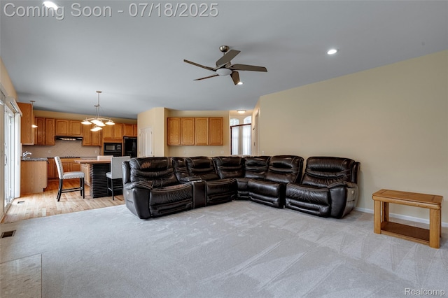 24352 Cavendish Ave W, Novi, MI 48375 - living room with ceiling fan, light carpet, and recessed lighting