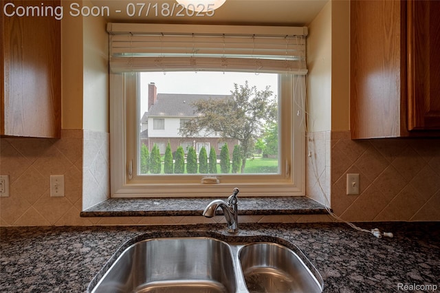 24352 Cavendish Ave W, Novi, MI 48375 - kitchen with healthy amount of natural light and dark stone counters