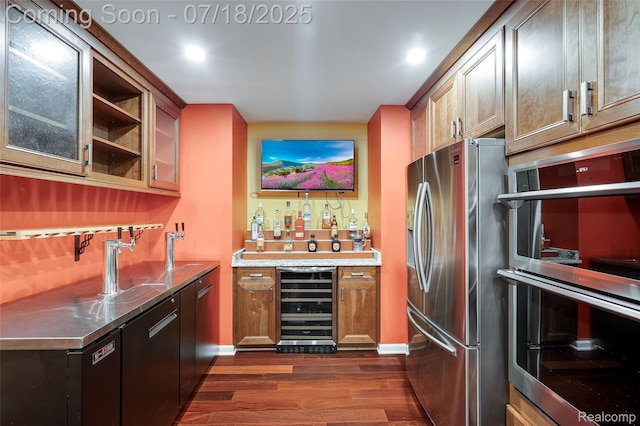 24352 Cavendish Ave W, Novi, MI 48375 - indoor wet bar featuring appliances with stainless steel finishes, dark wood finished floors, wine cooler, and recessed lighting