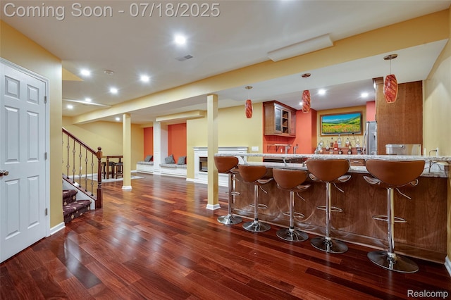 24352 Cavendish Ave W, Novi, MI 48375 - indoor wet bar with wood finished floors, stairs, recessed lighting, hanging light fixtures, and freestanding refrigerator
