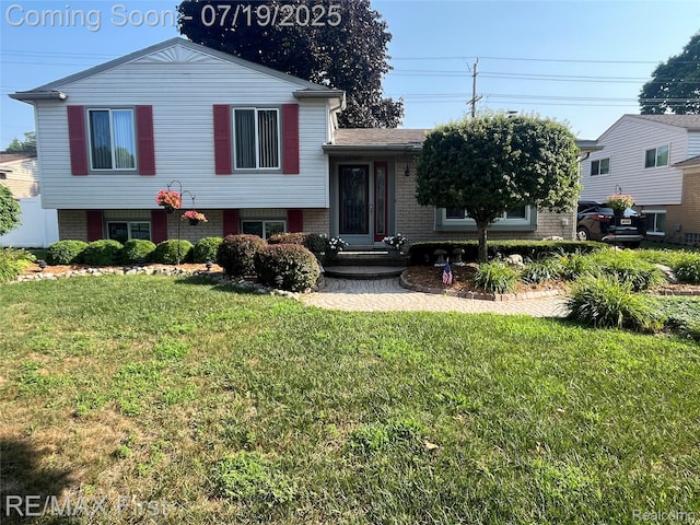 14348 Mary Grove Dr, Sterling Heights, MI 48313 - tri-level home with brick siding and a front lawn