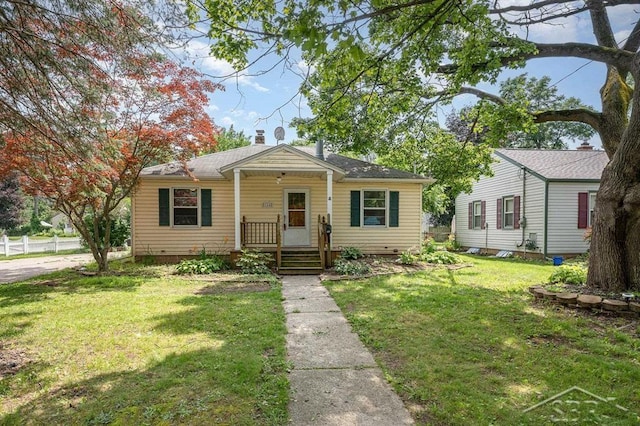114 E Sugnet Rd, Midland, MI 48642 - bungalow-style house featuring a front yard, a porch, and a chimney