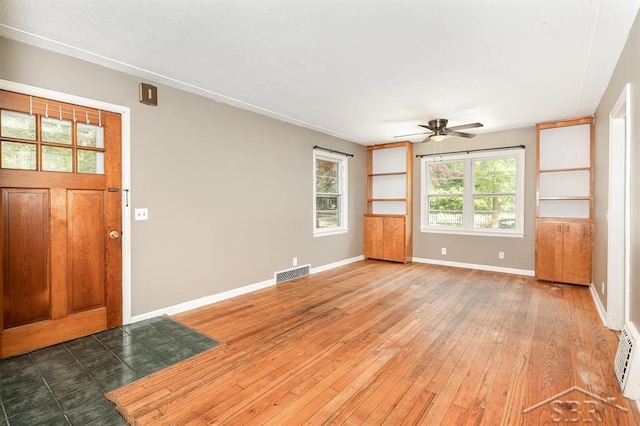 114 E Sugnet Rd, Midland, MI 48642 - entryway with ceiling fan and hardwood / wood-style flooring