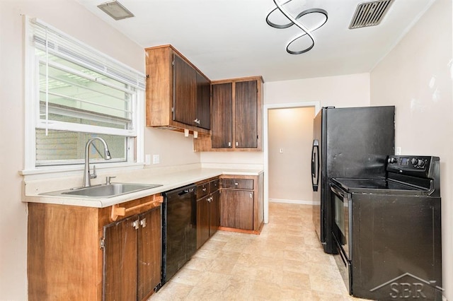 114 E Sugnet Rd, Midland, MI 48642 - kitchen with black appliances and light countertops