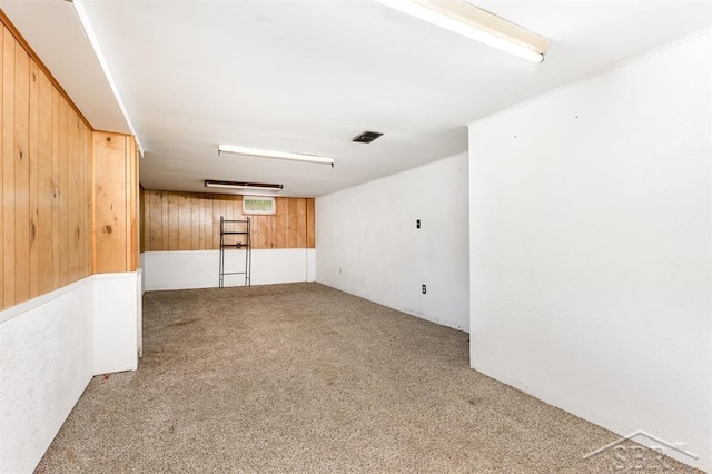 114 E Sugnet Rd, Midland, MI 48642 - spare room featuring carpet flooring and wood walls