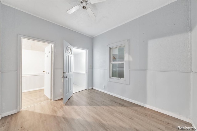 1943 Jarvis Ave, Warren, MI 48091 - spare room with wood finished floors, ceiling fan, and wainscoting