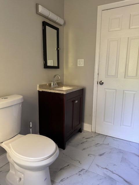3033 Williams St, Inkster, MI 48141 - bathroom featuring marble look tiles and vanity