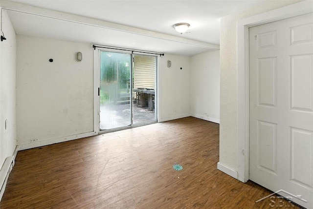 3704 Concord St, Midland, MI 48642 - unfurnished room featuring wood finished floors and a baseboard radiator
