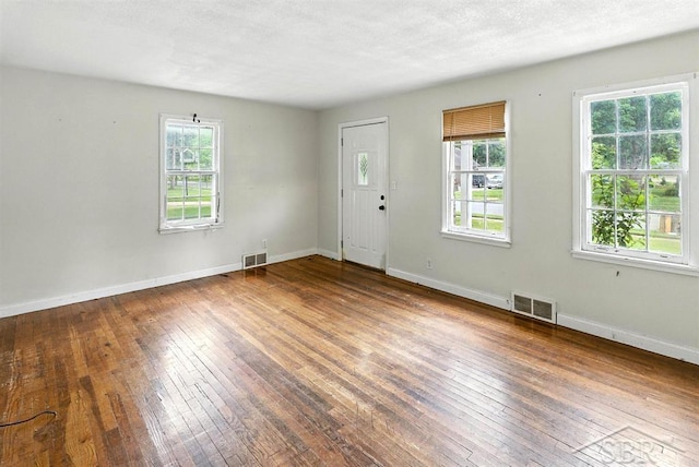 3704 Concord St, Midland, MI 48642 - foyer entrance featuring wood-type flooring and baseboards