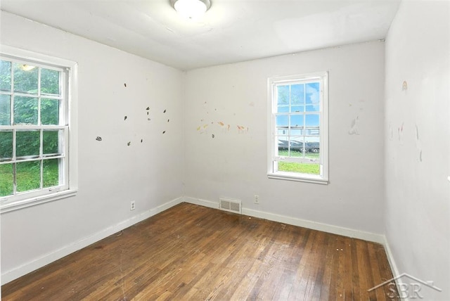 3704 Concord St, Midland, MI 48642 - empty room featuring wood-type flooring and healthy amount of natural light