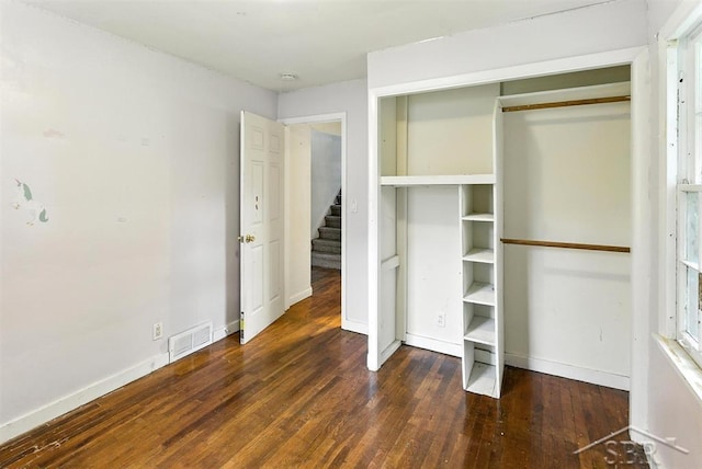 3704 Concord St, Midland, MI 48642 - unfurnished bedroom with wood finished floors and a closet
