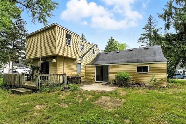 3704 Concord St, Midland, MI 48642 - back of house with a yard, a wooden deck, and a patio
