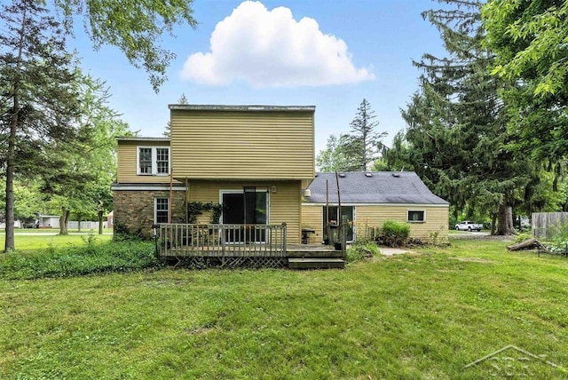 3704 Concord St, Midland, MI 48642 - back of house with a deck and a yard
