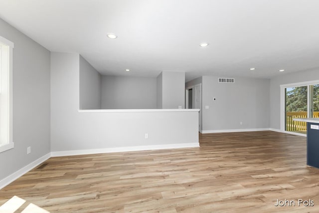 1025 Mechanic St, Big Rapids, MI 49307 - unfurnished living room with light wood-style flooring and recessed lighting