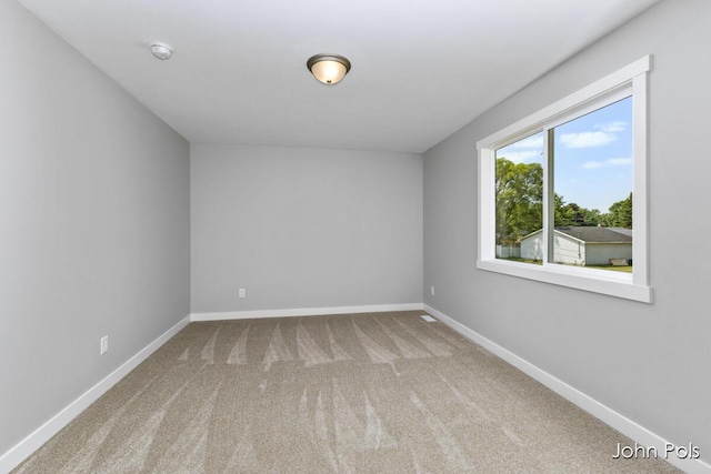 1025 Mechanic St, Big Rapids, MI 49307 - carpeted empty room with baseboards
