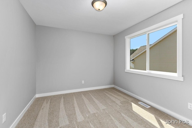 1025 Mechanic St, Big Rapids, MI 49307 - carpeted empty room with baseboards