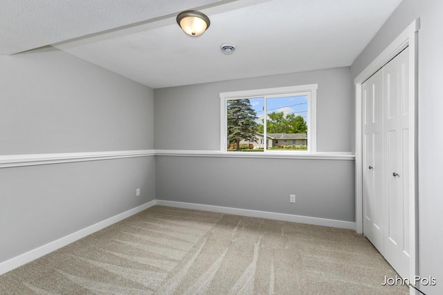 1025 Mechanic St, Big Rapids, MI 49307 - unfurnished bedroom featuring carpet and a closet