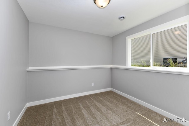 1025 Mechanic St, Big Rapids, MI 49307 - empty room featuring carpet flooring and baseboards
