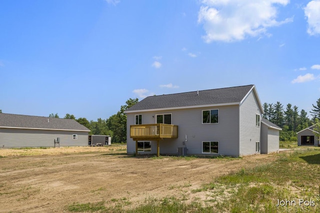 1025 Mechanic St, Big Rapids, MI 49307 - rear view of property featuring a wooden deck
