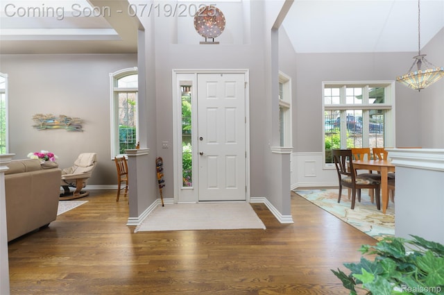 10827 Sparkling Waters Ct, South Lyon, MI 48178 - foyer entrance with wood finished floors and lofted ceiling