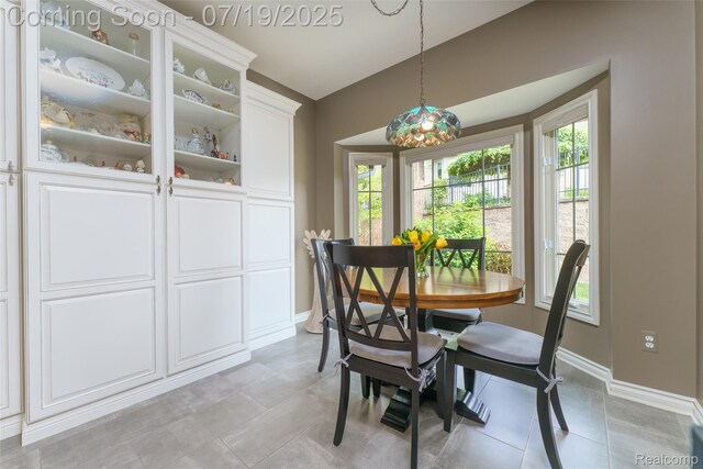 10827 Sparkling Waters Ct, South Lyon, MI 48178 - dining area featuring plenty of natural light and light tile patterned floors