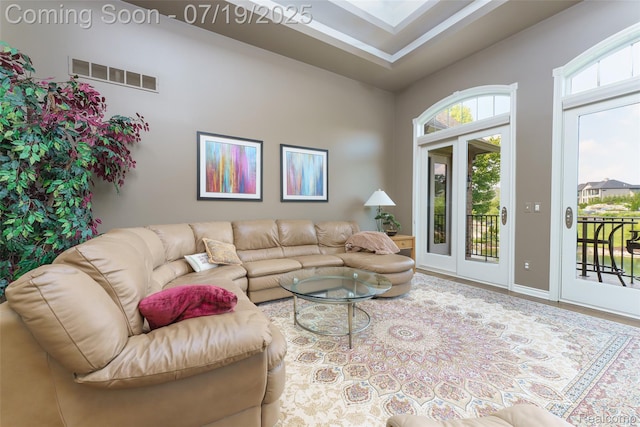 10827 Sparkling Waters Ct, South Lyon, MI 48178 - living room with a towering ceiling and baseboards