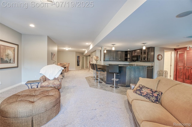 10827 Sparkling Waters Ct, South Lyon, MI 48178 - living room featuring light carpet, recessed lighting, and bar area