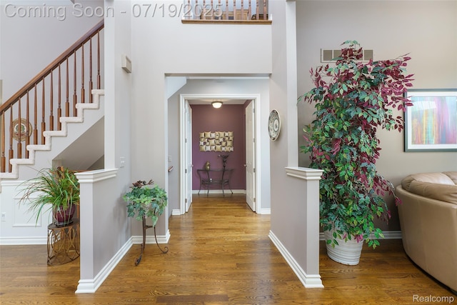 10827 Sparkling Waters Ct, South Lyon, MI 48178 - foyer entrance with wood finished floors and stairway