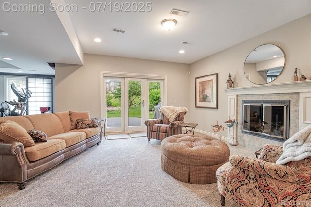 10827 Sparkling Waters Ct, South Lyon, MI 48178 - living room with healthy amount of natural light, carpet flooring, recessed lighting, and a tile fireplace